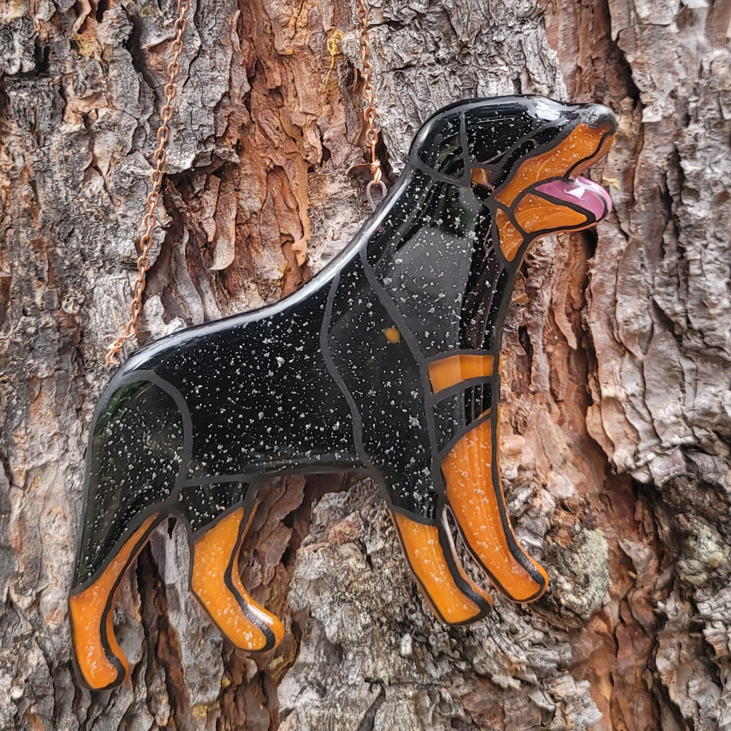 Rottweiler Glass Urn Ashes-Infused-Glass Ornament   A glass cremation urn suncatcher with a silhouette of a Rottweiler dog with cremation ashes inside. infusion glass artist Joele Williams ashes infused glass