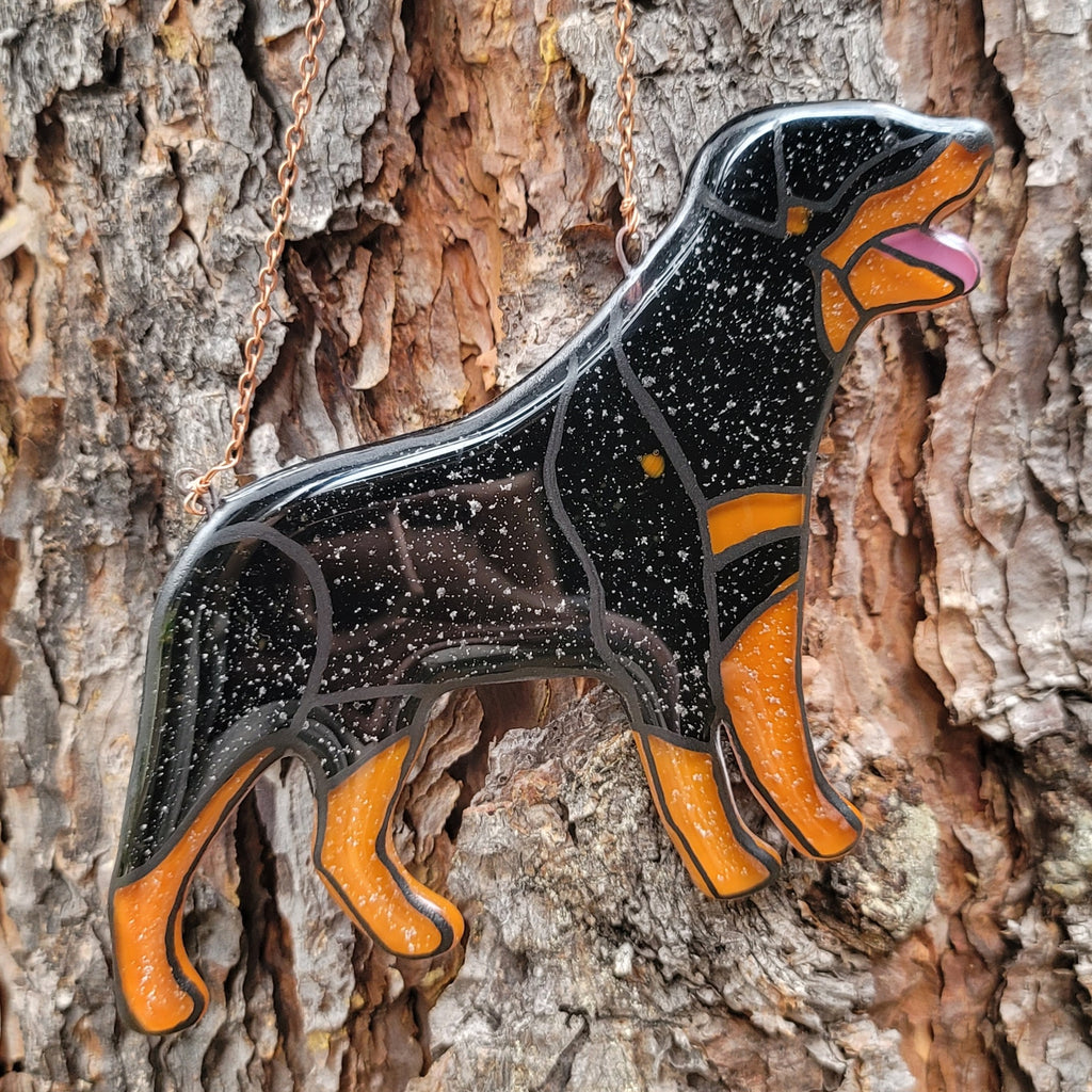 Rottweiler Glass Urn Ashes-Infused-Glass Ornament   A glass cremation urn suncatcher with a silhouette of a Rottweiler dog with cremation ashes inside. infusion glass artist Joele Williams ashes infused glass