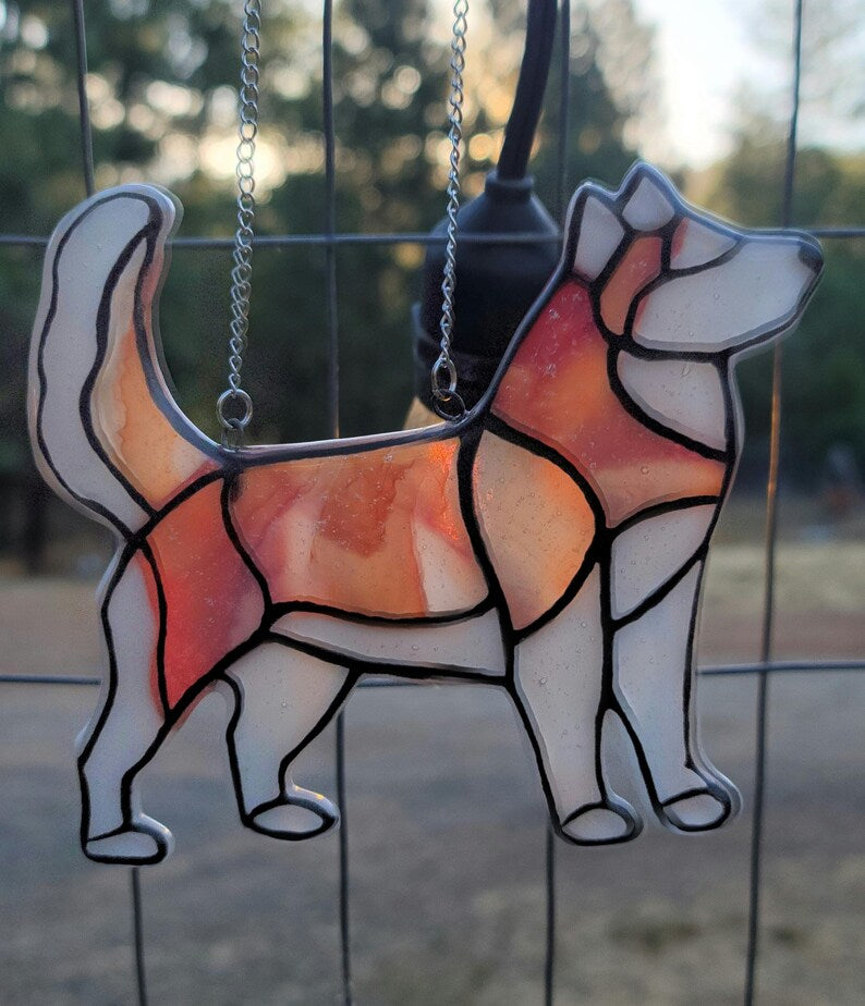 Red Husky Glass Urn Ashes-Infused-Glass Ornament   A glass cremation urn suncatcher with a silhouette of a Husky dog with cremation ashes inside. infusion glass artist Joele Williams ashes infused glass