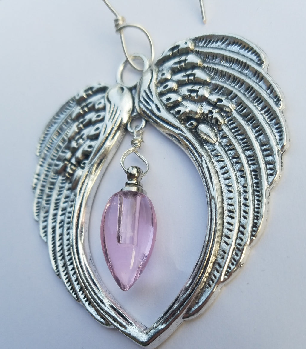 angel wing ornament urn bead suncatcher pink Unique Sympathy Gifts. Fill Yourself Cremation Ash Ring Lockets, Rings For Ashes, Cremation Jewelry Urn Bead Pendants, And Holiday Ornaments. Gift Wrapped and Free Shipping. Sympathy Mourning Glass Art Service. USA Handmade by Infusion Glass Human and Pet Cremation Ash Remembrance Urns AshesInfusedGlass.com