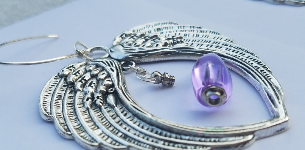 angel wing ornament urn bead suncatcher open purple Unique Sympathy Gifts. Fill Yourself Cremation Ash Ring Lockets, Rings For Ashes, Cremation Jewelry Urn Bead Pendants, And Holiday Ornaments. Gift Wrapped and Free Shipping. Sympathy Mourning Glass Art Service. USA Handmade by Infusion Glass Human and Pet Cremation Ash Remembrance Urns AshesInfusedGlass.com