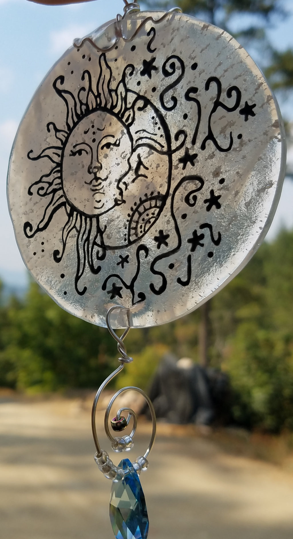 side view moon and sun sun catcher outside Celebration of life Funeral Memorials. Ashes in Glass Cremation Glass Art Sculptures, Cremation Wind Chimes, Cremation Sun Catchers, Table Displays, & Cremation Jewelry Custom USA Handmade by Infusion Glass. Ashes Infused Glass Human and Pet Cremation Ash Urns  Ashesinfusedglass.com