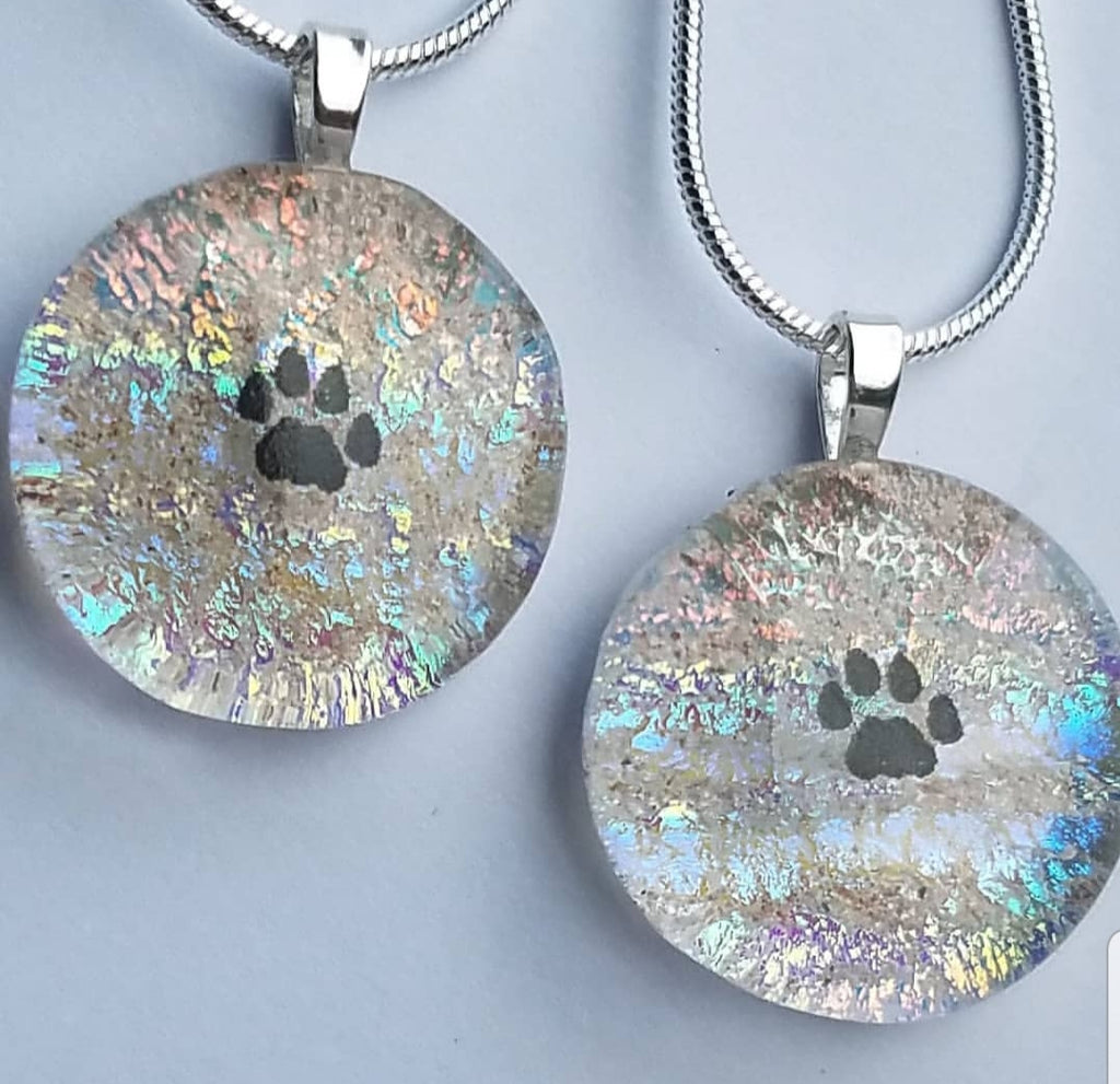 2 Tiny Paw print necklaces in Rainbow Clear Unique Pet Memorial Cremation Jewelry Ashes InFused Glass Handmade Cremation Memorial Glass Art,  Sympathy Gifts, Mourning Glass Art Service Cremation Ashes Infused in Glass. Quality Sterling Silver USA Handmade by Infusion Glass Artist Joele Williams Human and Pet Cremation Ash Remembrance Urns AshesInfusedGlass.com