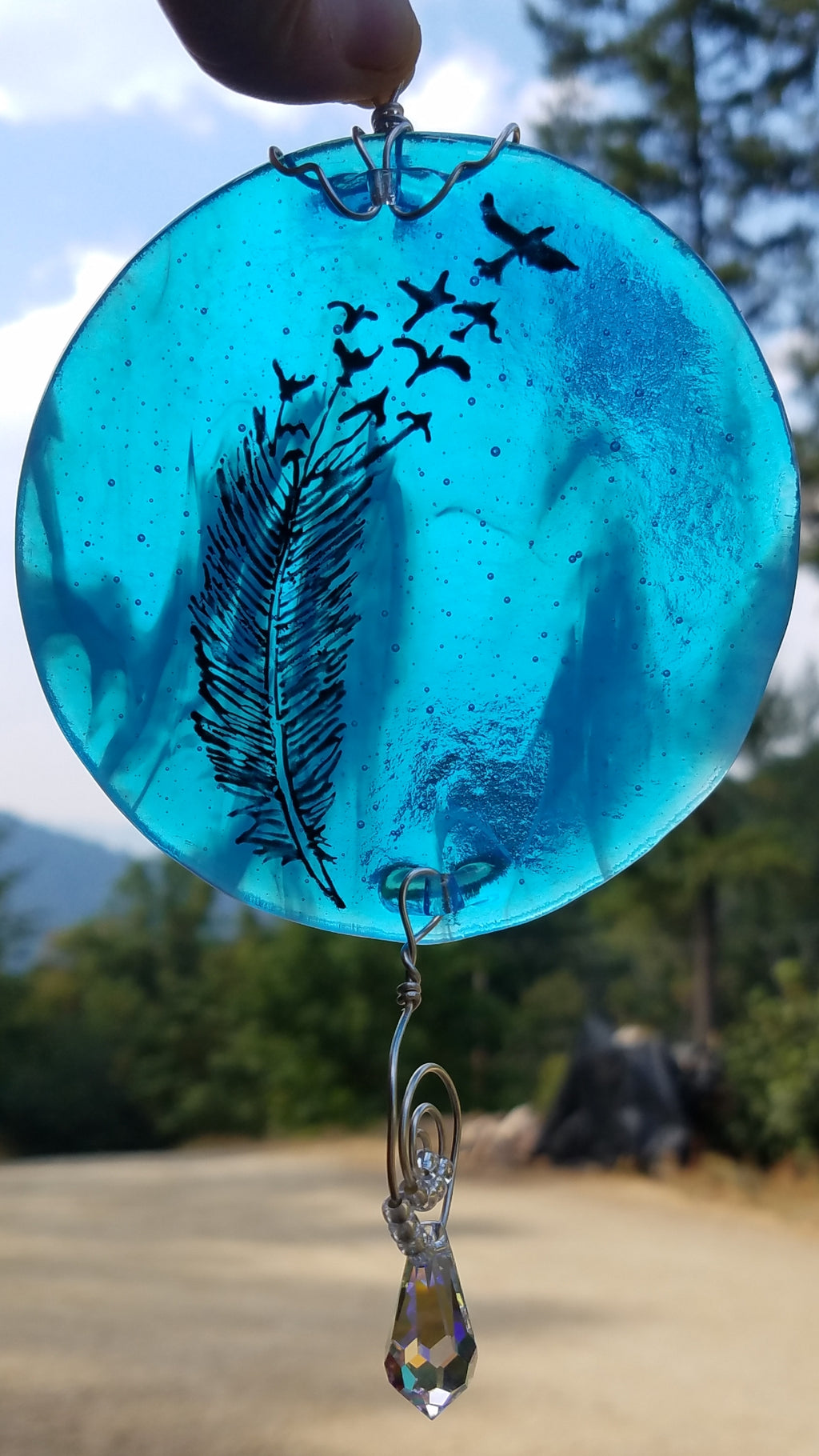 feather flying cremation ash suncatcher in blue Celebration of life Funeral Memorials. Ashes in Glass Cremation Glass Art Sculptures, Cremation Wind Chimes, Cremation Sun Catchers, Table Displays, & Cremation Jewelry Custom USA Handmade by Infusion Glass. Ashes Infused Glass Human and Pet Cremation Ash Urns  Ashesinfusedglass.com
